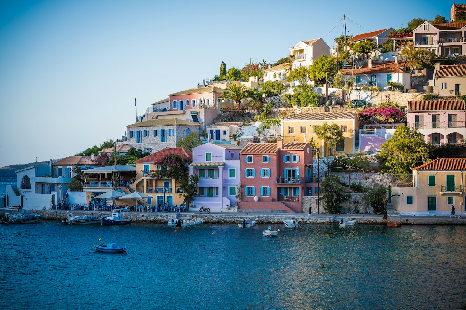 Colorful houses above a small Mediterranean harbor