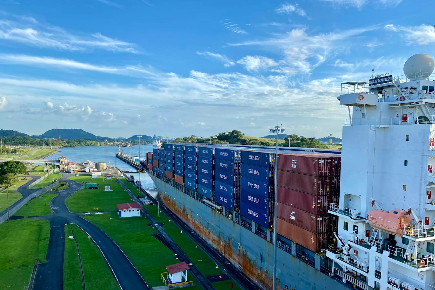A container ship passing through a lock of the Panama Canal