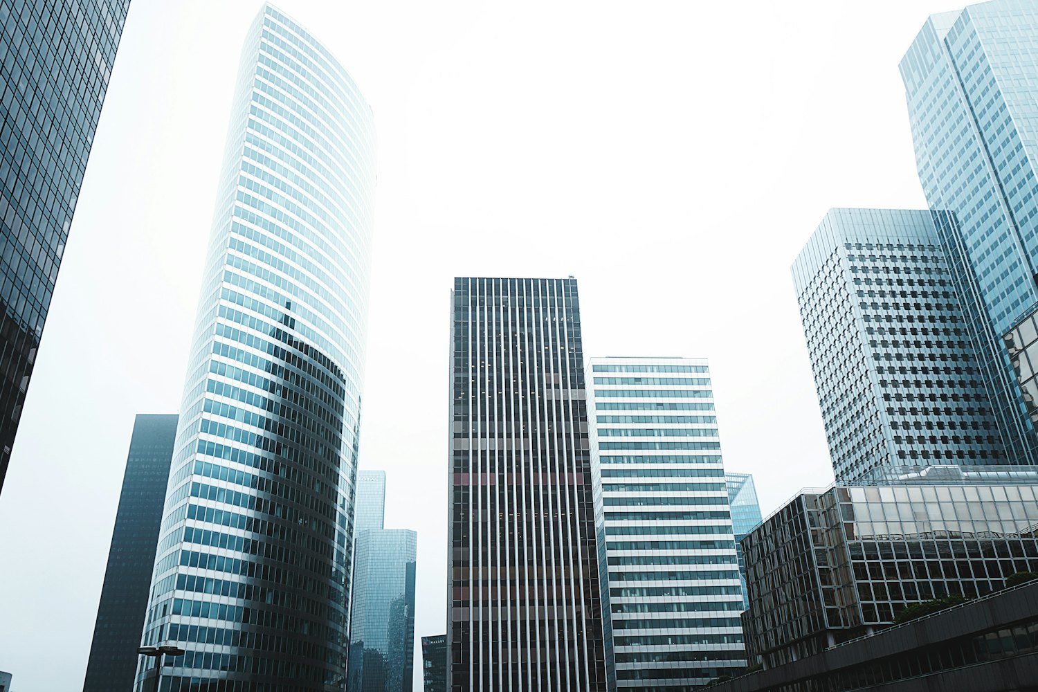 Glass office towers seen from street level